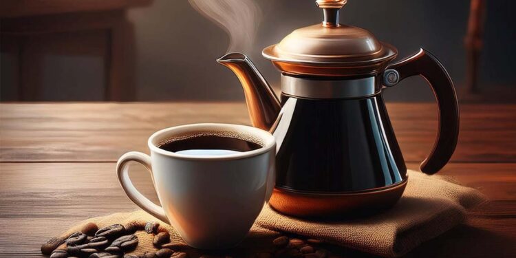 A pot and a cup of coffee on a table.