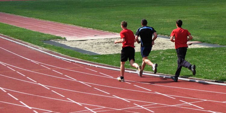 People running on a track.